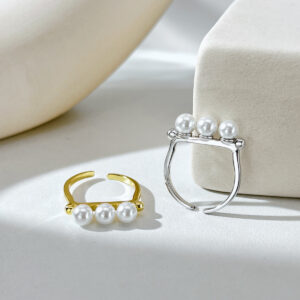 Ring jewelry piece crafted from premium sterling silver and shell pearls.